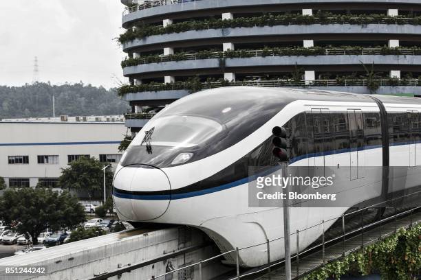 Co. SkyRail monorail train travels on an elevated track at the company's headquarters in Shenzhen, China, on Thursday, Sept. 21, 2017. China will...