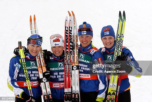 Pirjo Muranen, Virpi kuitunen, Riitta-liisa Roponen and Aino Kaisa Saarinen of Finland take 1st place, during the FIS Nordic World Ski Championships...