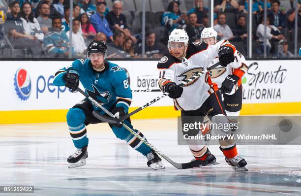 Corey Tropp of the Anaheim Ducks passes the puck against Mikkel Boedker of the San Jose Sharks at SAP Center on September 19, 2017 in San Jose,...