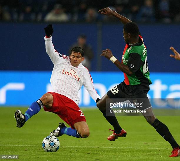 Tomas Rincon of Hamburg and Joel Tshibamba of Nijmegen battle for the ball during the UEFA Cup Round of 32 second leg match between Hamburger SV and...