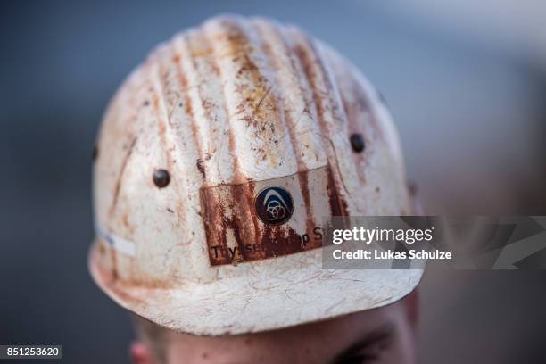 The logo of ThyssenKrupp is seen on a helmet of a German steelmaker during a protest against the recently announced fusion of ThyssenKrupp with...