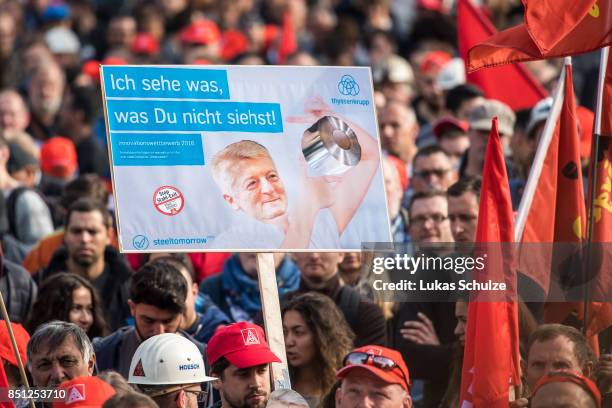 Workers from German steelmaker ThyssenKrupp protest against the recently announced fusion of ThyssenKrupp with steelmaker Tata Steel with a sign...