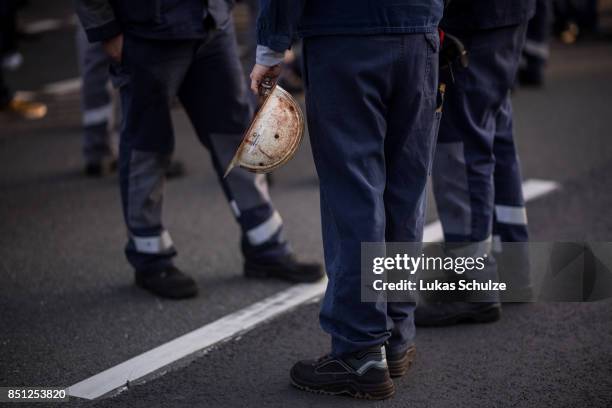 Workers from German steelmaker ThyssenKrupp protest against the recently announced fusion of ThyssenKrupp with steelmaker Tata Steel on September 22,...