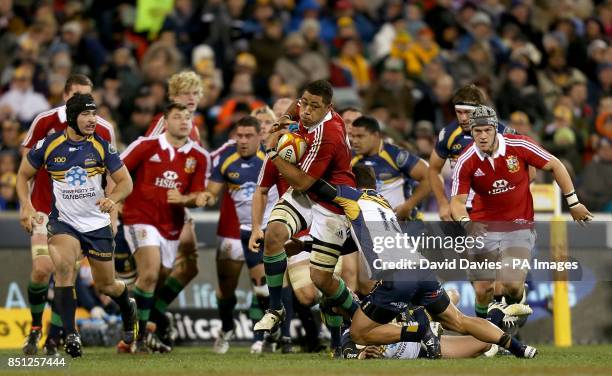 British and Irish Lions' Toby Faletau in action with ACT Brumbies' Matt Toomua