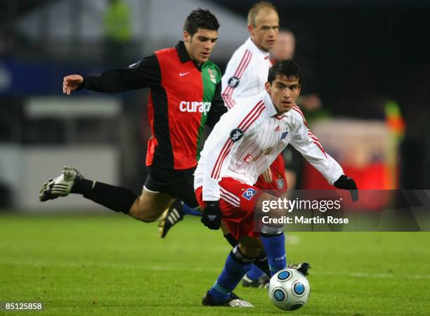 Tomas Rincon of Hamburg and Mostapha El Kabir of Nijmegen battle for the ball during the UEFA Cup Round of 32 second leg match between Hamburger SV...