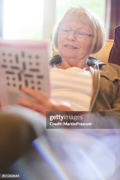 Mature Woman Crossword Puzzle Photos and Premium High Res Pictures Mature Woman Crossword Puzzle Photos and Premium High Res Pictures