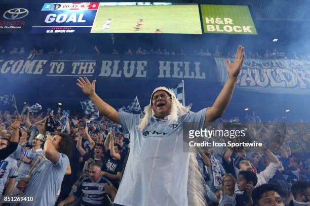 Fan Hector Solorio and others in The Cauldron celebrate after the team's second goalas Sporting Kansas City hosted the New York Red Bulls on...