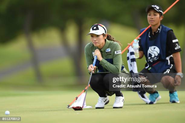 Akane Iijima of Japan lines up her putt on the 18th hole during the first round of the Miyagi TV Cup Dunlop Ladies Open 2017 at the Rifu Golf Club on...