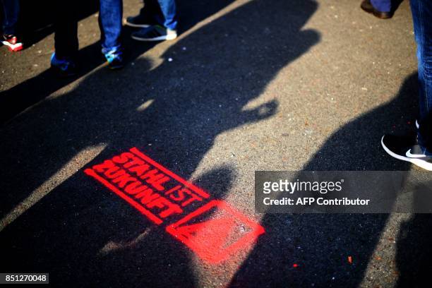 Sprayed slogan reading 'Steel is Future' is pictured during a protest by steelworkers of the ThyssenKrupp Steel Europe against fusion contract...