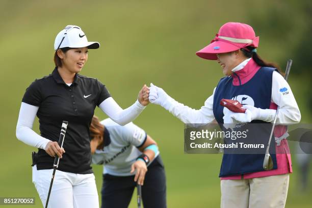 Rumi Yoshiba of Japan celebrates after making her birdie putt on the 18th hole during the first round of the Miyagi TV Cup Dunlop Ladies Open 2017 at...