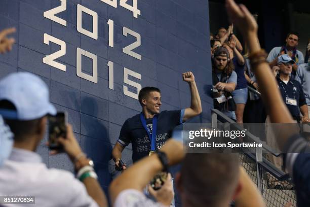 Captain Matt Besler paints "2017" on the wall of club honors under the owner's boxas Sporting Kansas City hosted the New York Red Bulls on September...