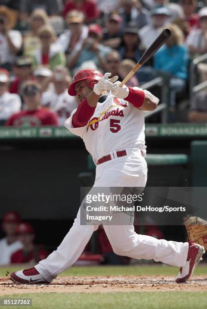 Albert Pujols of the St. Louis Cardinals bats against the Florida Marlins during a spring training game at Roger Dean Stadium on February 25, 2009 in...