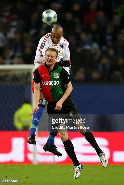 Alex Silva of Hamburg and Rutger Worm of Nijmegen head for the ball during the UEFA Cup Round of 32 second leg match between Hamburger SV and NEC...