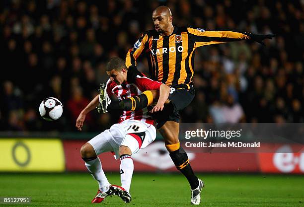 Caleb Folan of Hull battles with Kyle Walker of Sheffield United during the FA Cup sponsored by E.on, 5th round replay match between Hull City and...