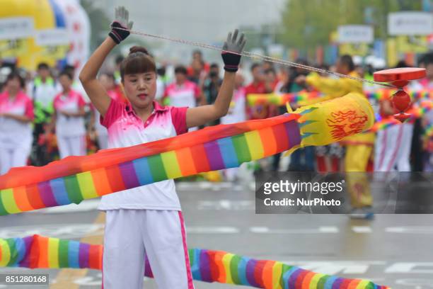 Demonstration of traditional dances and other activities ahead of the start to the fourth stage of the 2017 Tour of China 2, the 115.3km Huangshi...