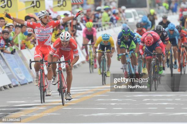 Marco Benfatto assisted by Matteo Malucelli from Androni Sidermec Bottecchia team on his way to win the fourth stage of the 2017 Tour of China 2, the...