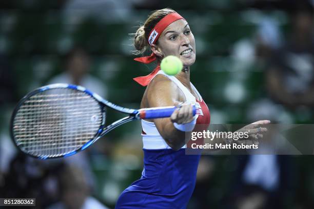 Dominika Cibulkova of Slovakia plays a forehand in her quarter final match against Caroline Wozniacki of Denmark during day five of the Toray Pan...