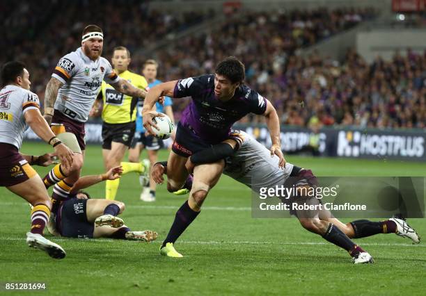 Jordan McLean of the Storm is challenged by his opponents during the NRL Preliminary Final match between the Melbourne Storm and the Brisbane Broncos...