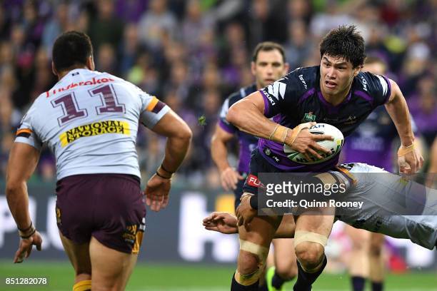 Jordan McLean of the Storm is tackled during the NRL Preliminary Final match between the Melbourne Storm and the Brisbane Broncos at AAMI Park on...