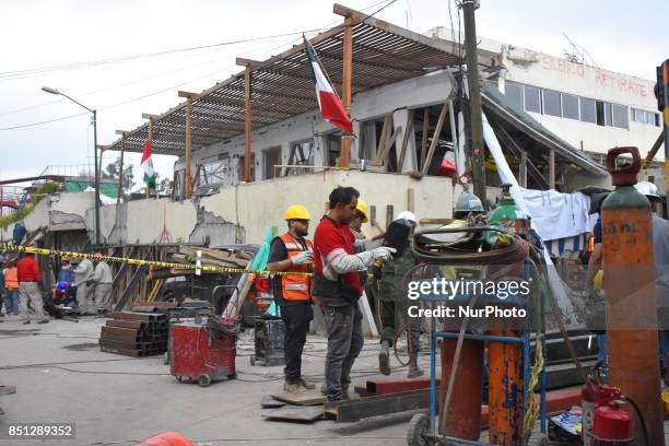 Voluntaries are seen during the rescue work in Enrique Rebsamen College under rubble for the 7.1 magnitude earthquake occurred, at lest 273 people...