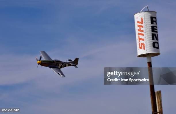 Mark Murphy pilot of the F-51D Mustang "Little Horse" rounds the pylon in the Unlimited Heat 3C race at the 54th National Championship Air Races the...