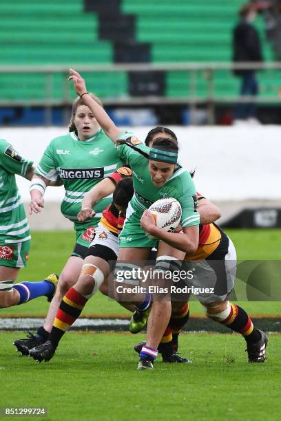 Rhiarna Ferris of Manawatu tries to break free from a tackle during the round four Farah Palmer Cup match between Manawatu and Waikato at Central...