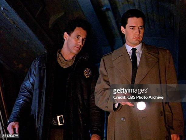 Michael Ontkean as Sheriff Harry S. Truman and Kyle MacLachlan as Special Agent Dale Cooper track down a killer in the pilot episode screen grab of...