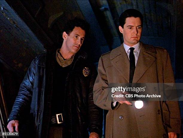 Michael Ontkean as Sheriff Harry S. Truman and Kyle MacLachlan as Special Agent Dale Cooper track down a killer in the pilot episode screen grab of...