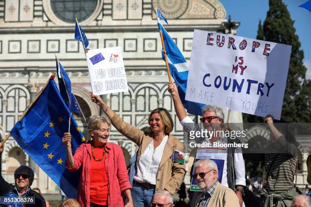 Anti-Brexit campaigners hold placards outside the Basilica di Santa Maria Novella in Florence, Italy, on Friday, Sept. 22, 2017. U.K. Prime Minister...