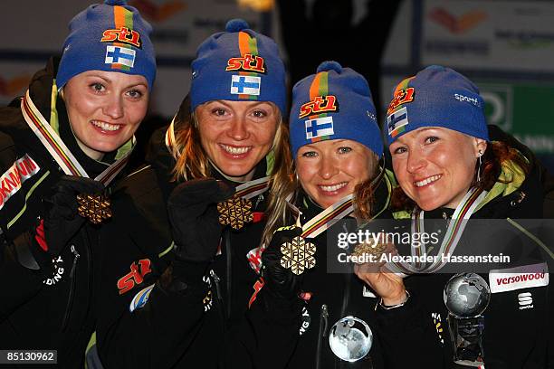 Pirjo Muranen, Virpi Kuitunen, Riiita-Liisa Roponen and Aino Kaisa Saarinen pose with the Gold medals won during the Ladies Cross Country Relay 4x5KM...