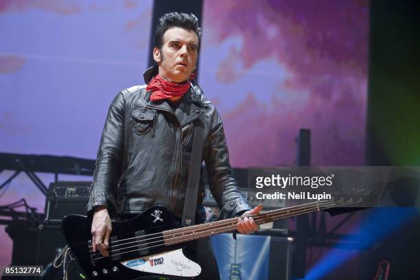 Simon Gallup of The Cure performs at the O2 Arena on February 26, 2009 in London, England.
