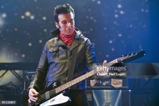 Simon Gallup of The Cure performs at the O2 Arena on February 26, 2009 in London, England.