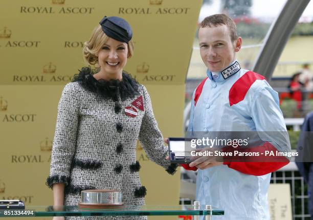 Actress Joanne Froggatt presents the Jamie Spencer the winning jockey of the Wokingham Stakes during day five of the Royal Ascot meeting at Ascot...