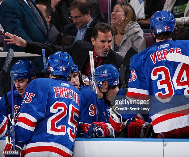 Head coach John Tortorella of the New York Rangers discuss a play on the bench during a game against the Florida Panthers on February 26, 2009 at...
