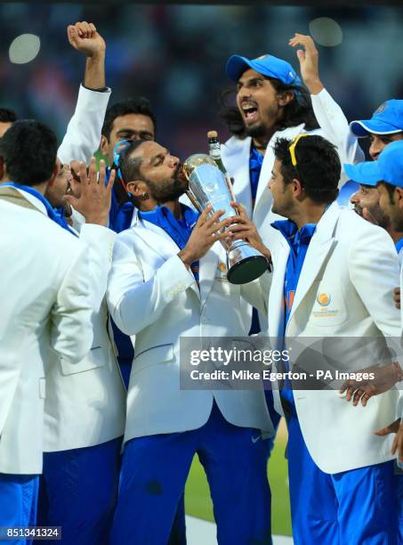 India's Shikhar Dhawan celebrates with the trophy during the ICC Champions Trophy Final at Edgbaston, Birmingham.