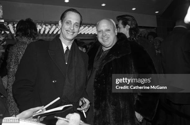 American filmmaker John Waters , and American actor Harris Glen Milstead , better known as Divine, pose for a photo outside the Waverly Theater at...