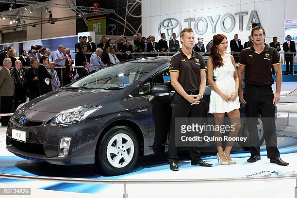 Sam Mitchell and Luke Hodge of the Hawthorn Football Club helps launch the Toyota Prius during the Melbourne International Motor Show 2009 at the...
