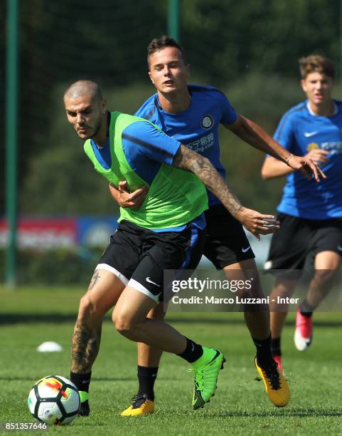 Mauro Emanuel Icardi is challenged by Zinho Vanheusden during the FC Internazionale training session at the club's training ground Suning Training...