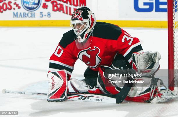 Martin Brodeur of the New Jersey Devils defends his net against the Colorado Avalanche at the Prudential Center on February 26, 2009 in Newark, New...