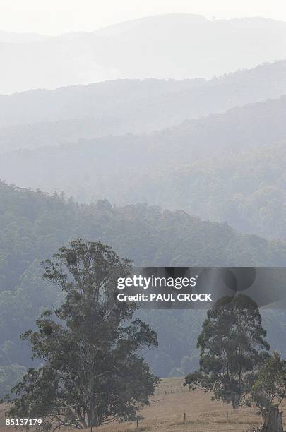 Smoke lingers over the mountains near Neerim South from the Bunyip Ridge Fire which continues to burn within containment lines in the Bunyip State...