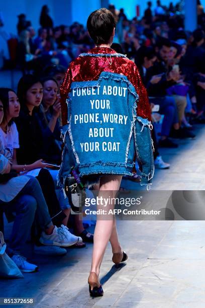 Model presents a creation for fashion house Annakiki during the Women's Spring/Summer 2018 fashion shows in Milan, on September 22, 2017. / AFP PHOTO...