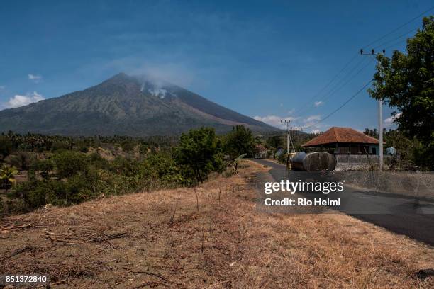 The arid northeastern slopes of Mt Agung in the Kubu district are subject to seasonal brush fires and have recently mistaken for volcanic activity by...