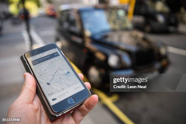 In this Photo Illustration, a phone displays the Uber ride-hailing app on September 22, 2017 in London, England. The Transport Regulator has...