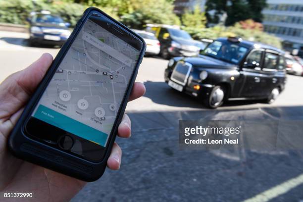 In this Photo Illustration, a phone displays the Uber ride-hailing app on September 22, 2017 in London, England. The Transport Regulator has...