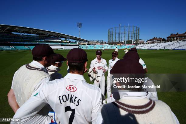 Surrey Captain Gareth Batty talks to his team as they head out after lunch during day four of the Specsavers County Championship Division One match...