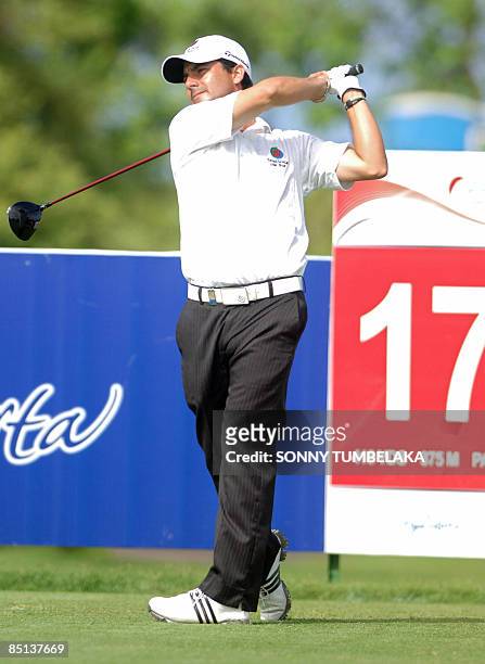 Felipe Aguilar of Chile hits a tee shot during the Indonesia Open golf tournament Indonesia in Denpasar on the resort island of Bali on February 27,...