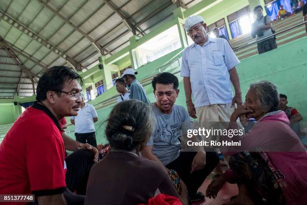 At a camp for evacuees from the slopes of the volcano Mt Agung in Bali which has been placed on Yellow Alert level 3, in the sports arena in...