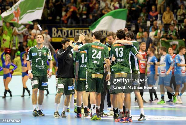 Drago Vukovic, Frederik Simak, Frederik Simak, Steffen Faeth and Kevin Struck of Fuechse Berlin celebrate the 26:24 win after the game between...