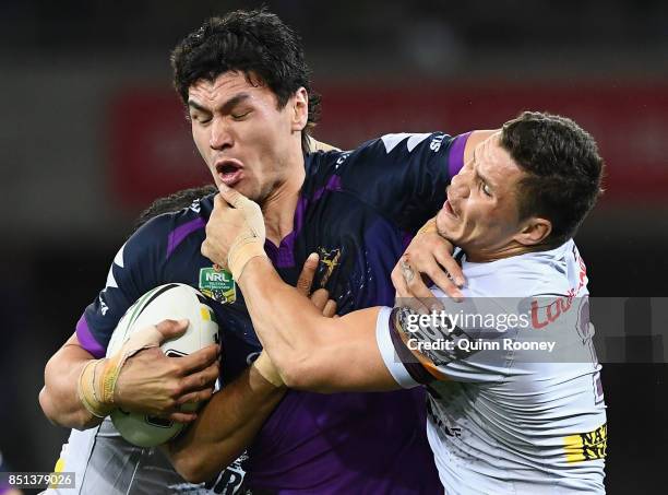 Jordan McLean of the Storm is tackled during the NRL Preliminary Final match between the Melbourne Storm and the Brisbane Broncos at AAMI Park on...