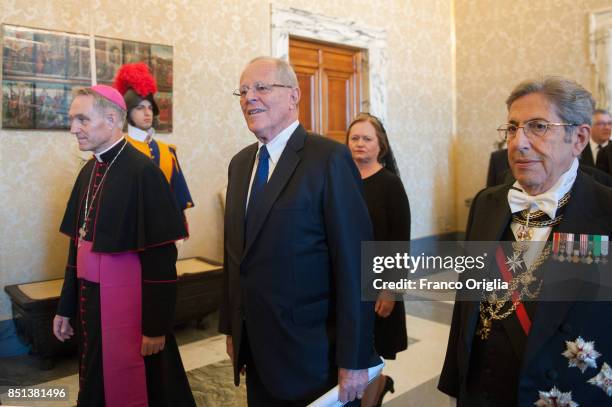 President of Peru Pedro Pablo Kuczynski and his wife Nacy Kuczynski. Flanked by the prefect of the papal household Georg Gaenswein. As they arrive at...